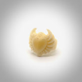 Hand carved natural bone winged heart ring. Natural bone ring with heart design. Hand made ring, delivered with international airmail. Postage is included. One only bone ring.
